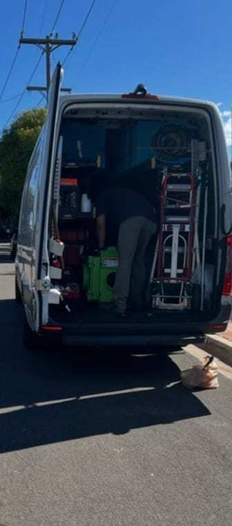 Rear of a service van loaded with equipment