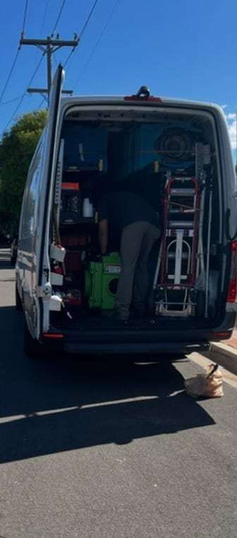 Rear of a service van loaded with equipment
